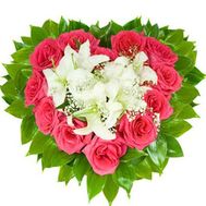 A composition of 12 roses and 1 lily