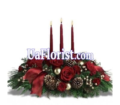 A composition of flowers for the New Year with 3 candles A composition of flowers for the New Year with 3 candles